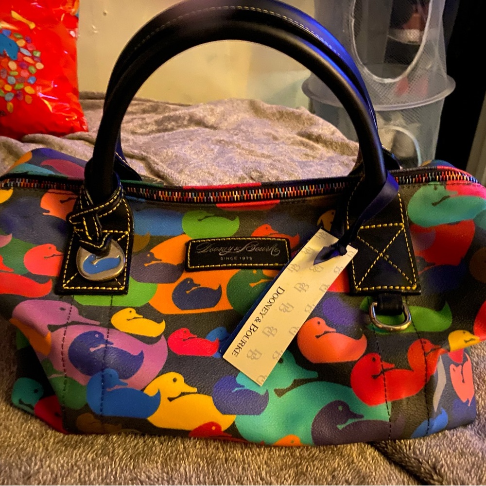 Dooney&Bourke bag. Brand new w/tags. Price on tag is 150$ b4 tax.Asking 100$ obo